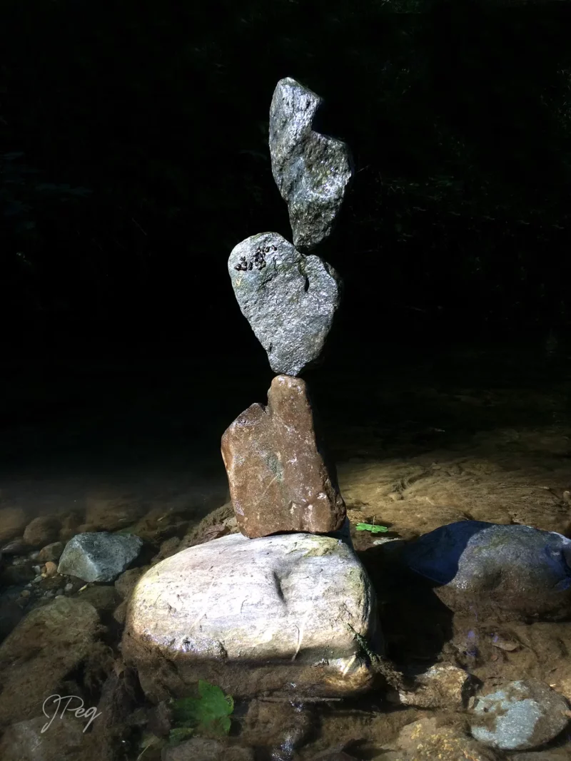 Stacked stones in streambed, nature balance art