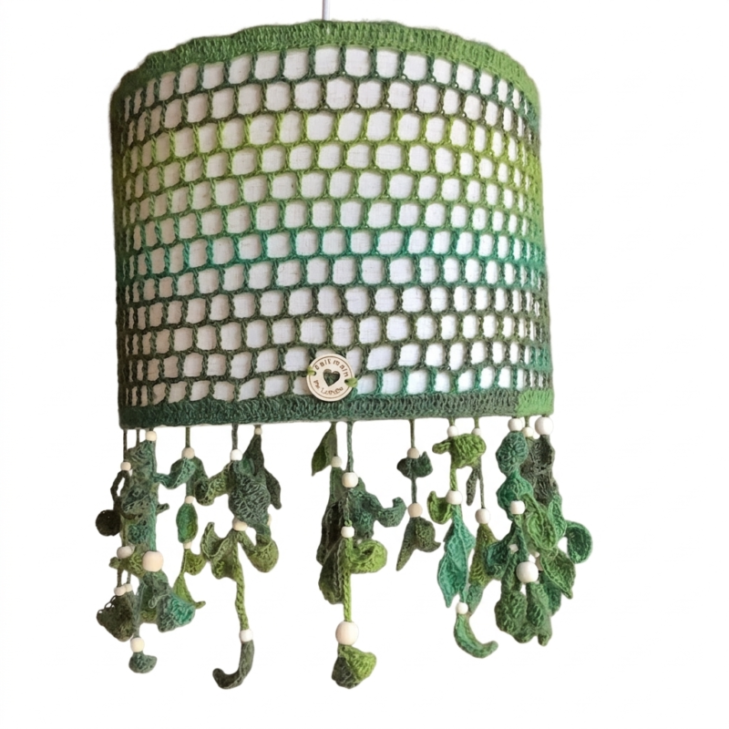 Green crocheted lampshade with dangling leaf decorations
