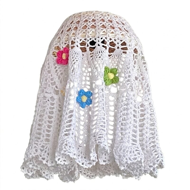 Crocheted lace ghost costume with colourful flower decorations
