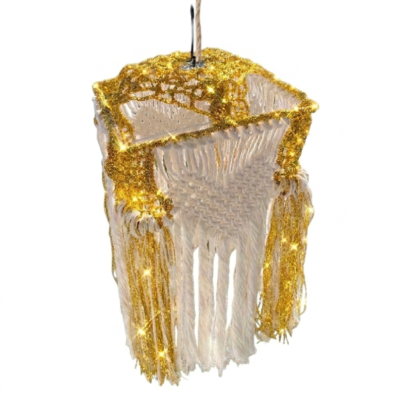 White macramé lantern with gold fairy lights