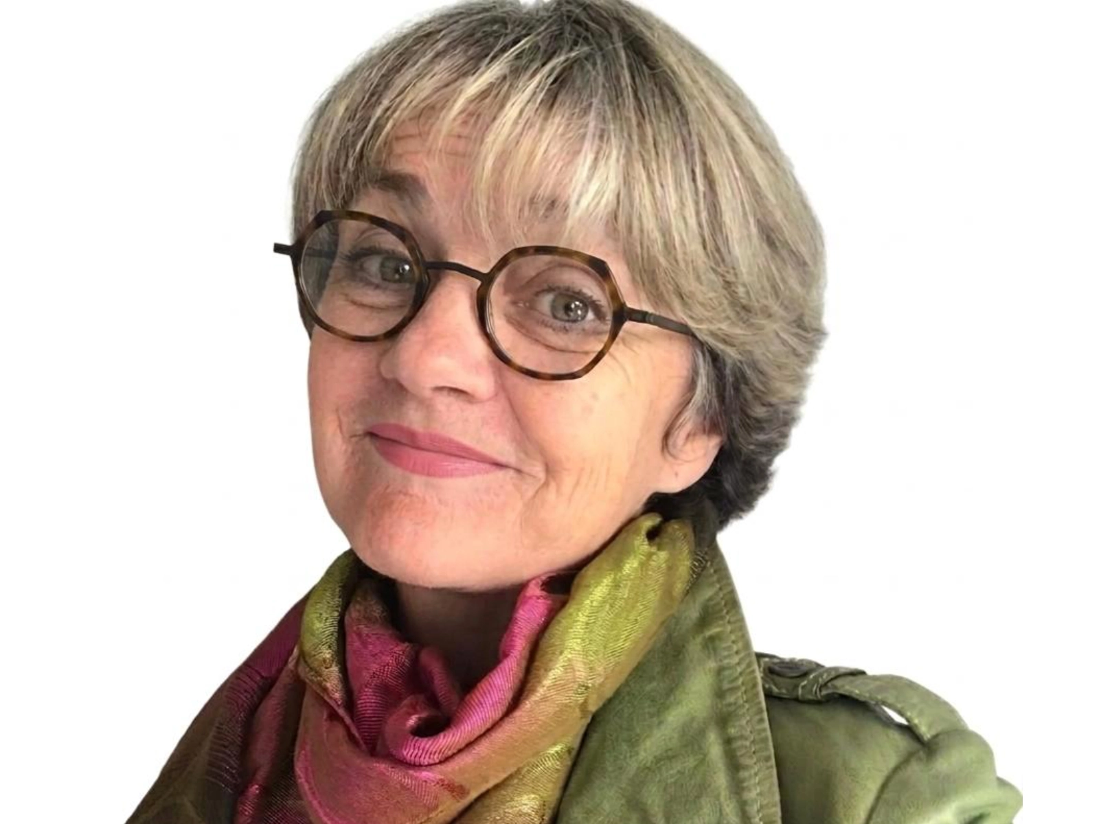 Smiling woman with glasses and colourful scarf