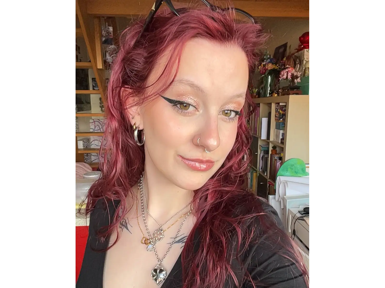 Woman with red hair and winged eyeliner